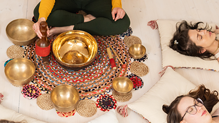 People meditating by a harmonic sound bath