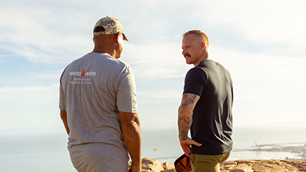 Two men talking.