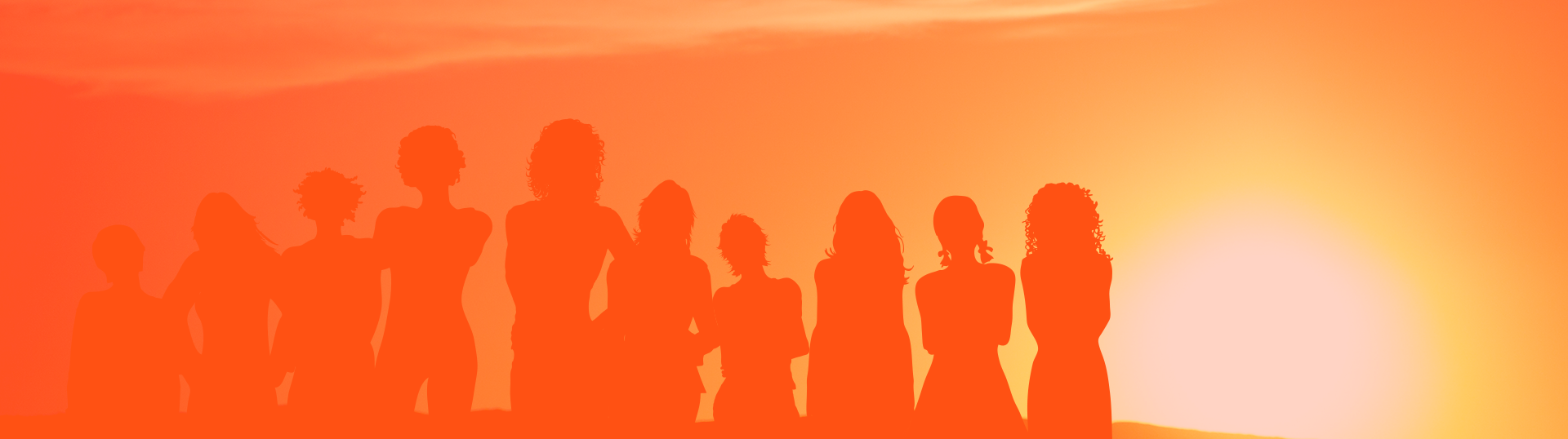 Outline of a group of female children with their back to the sunset.