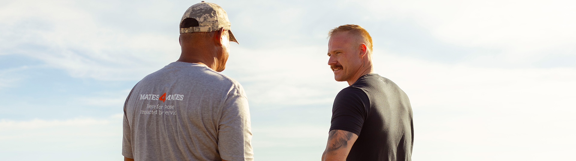 Two men talking.